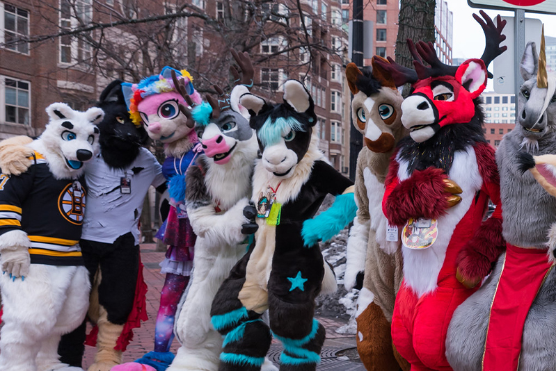 A group of fursuiters, posing for a photo in Boston